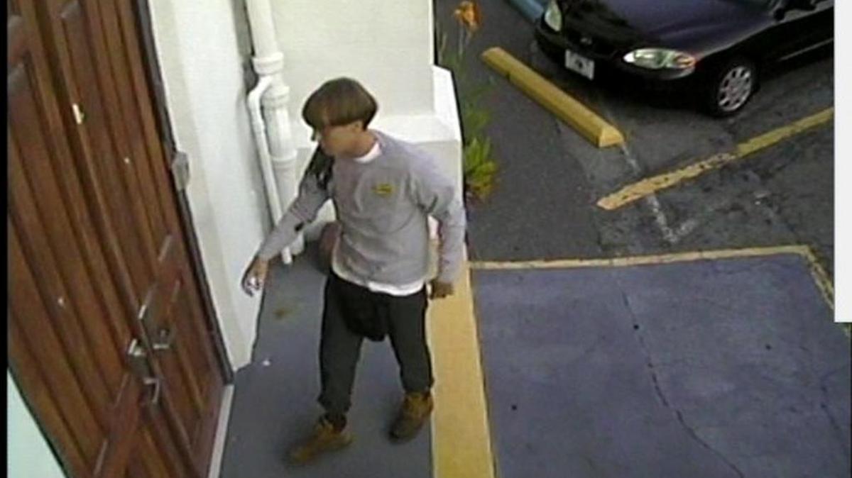 Dylann Roof at the door of Emanuel AME Church on June 17, 2015
