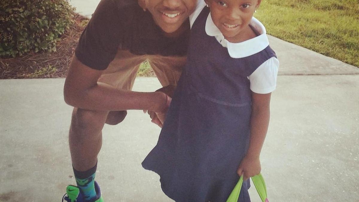 Dominique Williams (left) poses with his little sister, Lindsay Williams, before her first day of school, and before he walked her to class.