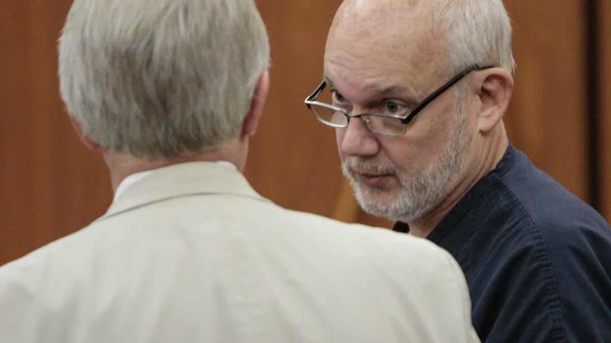 Chuck Sullivan talks with his attorney, James Falk, during his commitment hearing in State court at Richland County Courthouse.