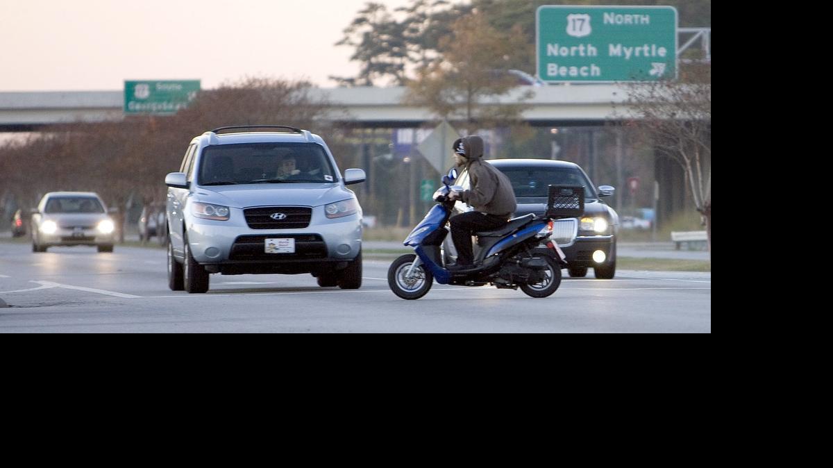 
A moped rider makes his way across U.S. 501 on Seaboard Street in Myrtle Beach in this 2011 file photo.
