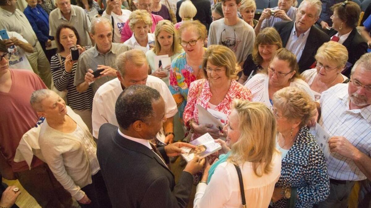 
Dr. Ben Carson greets supporters and signs copies of his book following a speech in Winyah Auditorium in May. 
