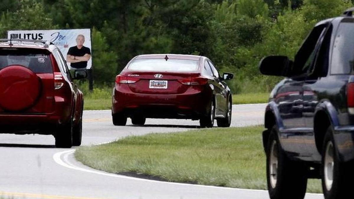 
Carolina Forest Boulevard traffic moves on two lanes past undeveloped land on July 11. | jblackmon@thesunnews.com
