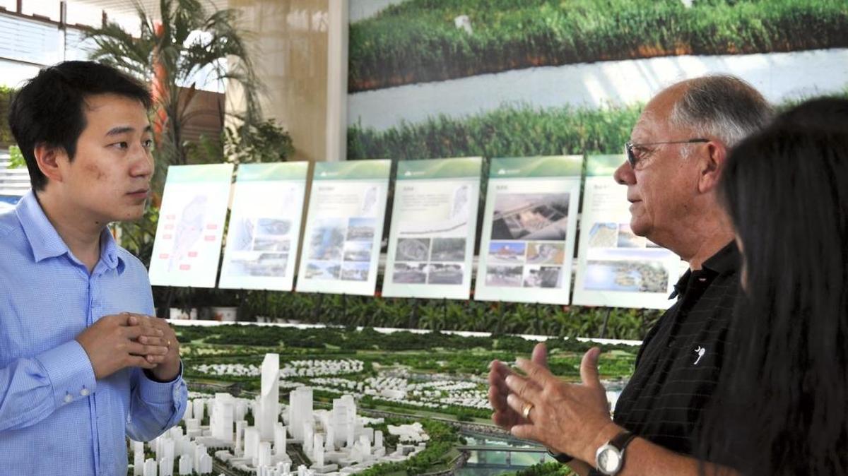 
Myrtle Beach Mayor John Rhodes speaks with a Chinese architect about an eco-friendly city being built in Xiamen during a 2011 trip. 
