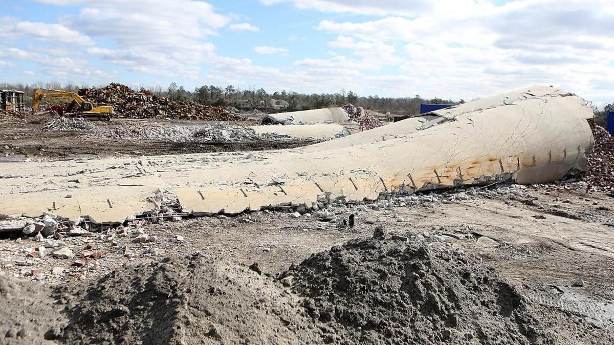 Debris of the 300-foot tall stacks at the Grainger Generation Station in Conway after a controlled demolition in November.