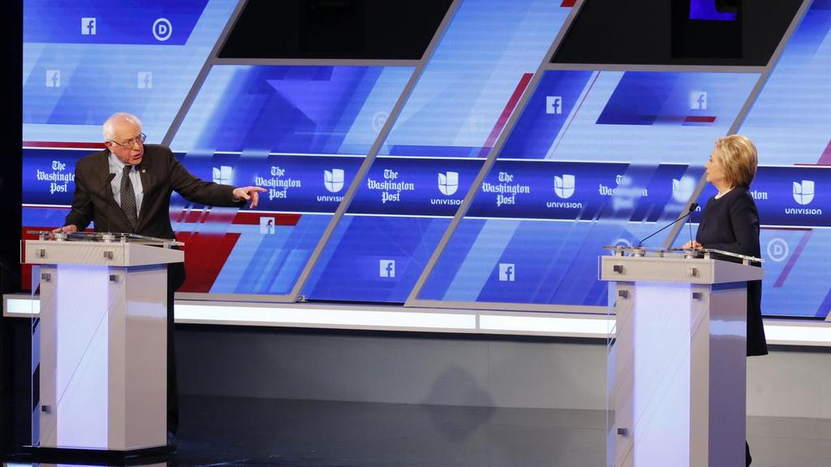 Democratic presidential candidate, Sen. Bernie Sanders, I-Vt, gestures towards Democratic presidential candidate, Hillary Clinton , durings the Univision, Washington Post Democratic presidential debate at Miami-Dade College, Wednesday, March 9, 2016, in Miami, Fla.