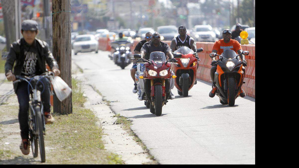 
People and motorcycles begin to fill the streets in Atlantic Beach during the annual Memorial Day Bikefest on Friday, May 23, 2014. 


