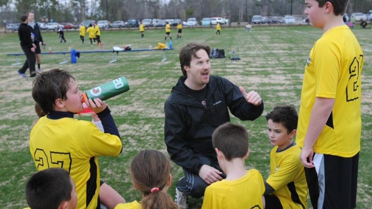 
North Myrtle Beach City League coach Marty Slapnik talks to the "Crew" team after their match on opening day of the North Myrtle Beach Park & Sports Complex in March 2014. The 160-acre complex includes two dog parks, a meadow, amphitheater, six ballfields and eight soccer/lacrosse fields, picnic areas, a fishing lake and trails. 
