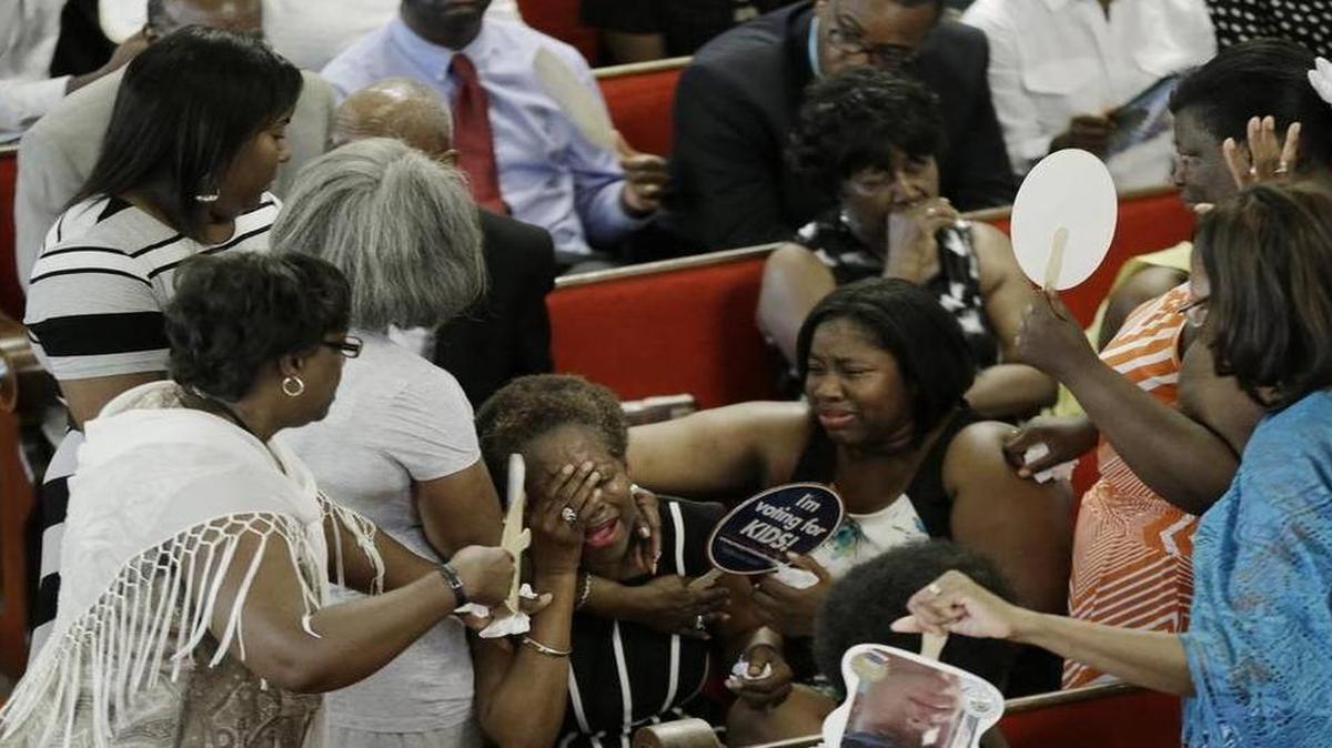 
Parishioners pray and weep at the Emanuel AME Church Sunday, June 21, 2015, in Charleston, S.C., four days after a mass shooting that claimed the lives of its pastor and eight others.
David Goldman AP

