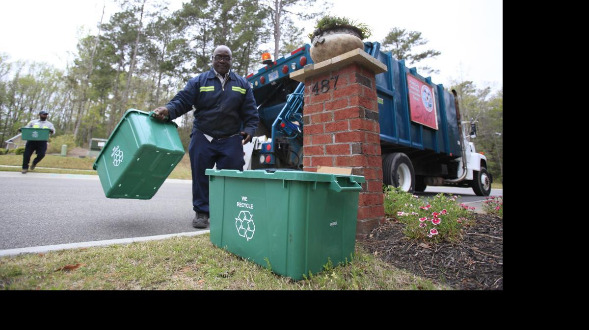 
Drivers Terry Bessent (center) and Tommy Bell of the Horry County Solid Waste Authority reclaim recyclables in this 2011 file photo. 
