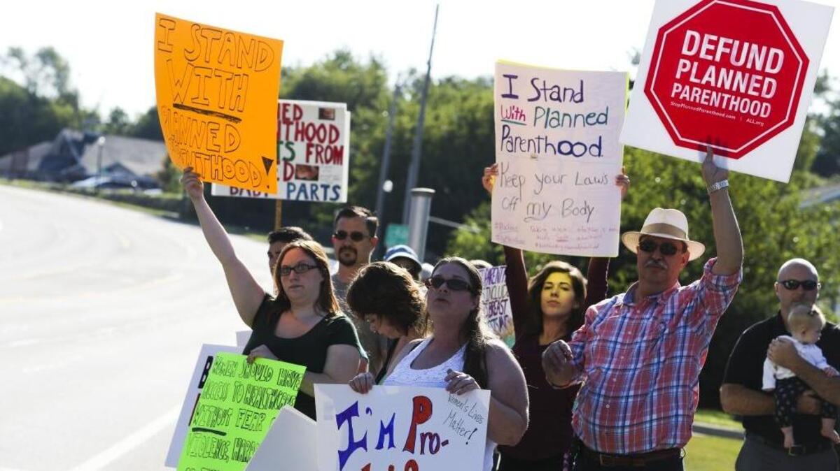 
Anti-abortion activists protest in front of Planned Parenthood in Kalamazoo, Mich., on Saturday, Aug. 22, 2015.
