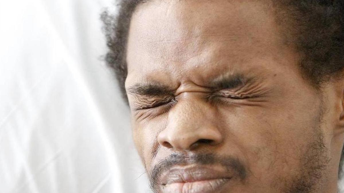 
“I come out of the bathroom and I just see figures and it's boom, boom, boom. I'm dead," Julian Betton, grimicing in pain, says from his bed on Friday, July 10, 2015. He's recounting what he remembers of the mid-April day he was shot at least nine times by officers executing a warrant at his Withers Swash Drive apartment. After seeing the figures, he woke up from a coma six weeks later and is paralyzed. The three officers involved in the shooting are with the 15 Circuit Drug Enforcement Unit. They have been cleared of any charges by the State Law Enforcement Division. The SLED report states Betton did not fire at the officers. The shooting happened in the execution of a warrant stemming from a marijuana investigation. Officers seized less than eight ounces of marijuana, $970 in cash, an assault rifle and a handgun in the April 16 incident. Betton has been charged with three counts of possession with intent to distribute but he has not been charged with weapons violations. | By Janet Blackmon Morgan jblackmon@thesunnews.com
