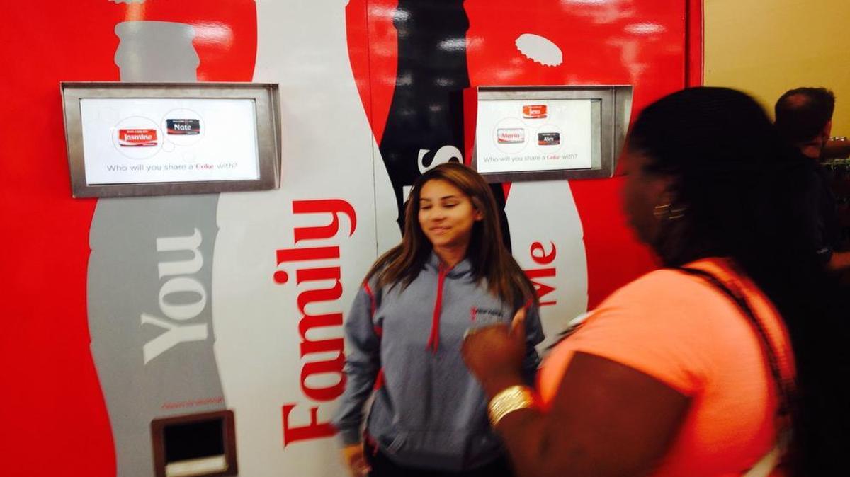 
A worker monitors the long line of people in the Myrtle Beach Walmart ready to get two free cans with the name of a loved one on them.
