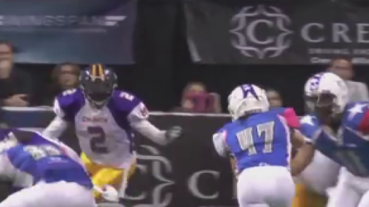 
Jen Welter takes a handoff in a men's pro football game in February 2014.
Screen shot/YouTube/Jordan Ent.

