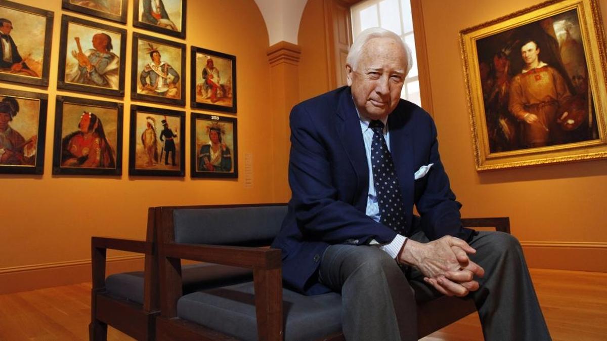 In this May 13, 2011, file photo, historian and author David McCullough poses with art by George Catlin, one of the artists featured in his new book, "The Greater Journey," at the Catlin galleries of the Smithsonian American Art Museum in Washington. McCullough's latest work of history, "The Wright Brothers," was released on May 5, 2015.