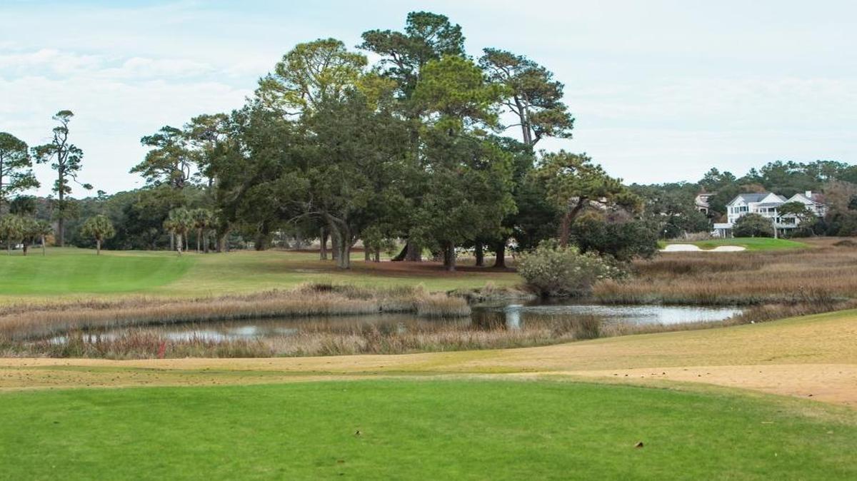 The “Waterloo” No. 13 at the Dunes Club is a par 5 that winds around Lake Singleton.