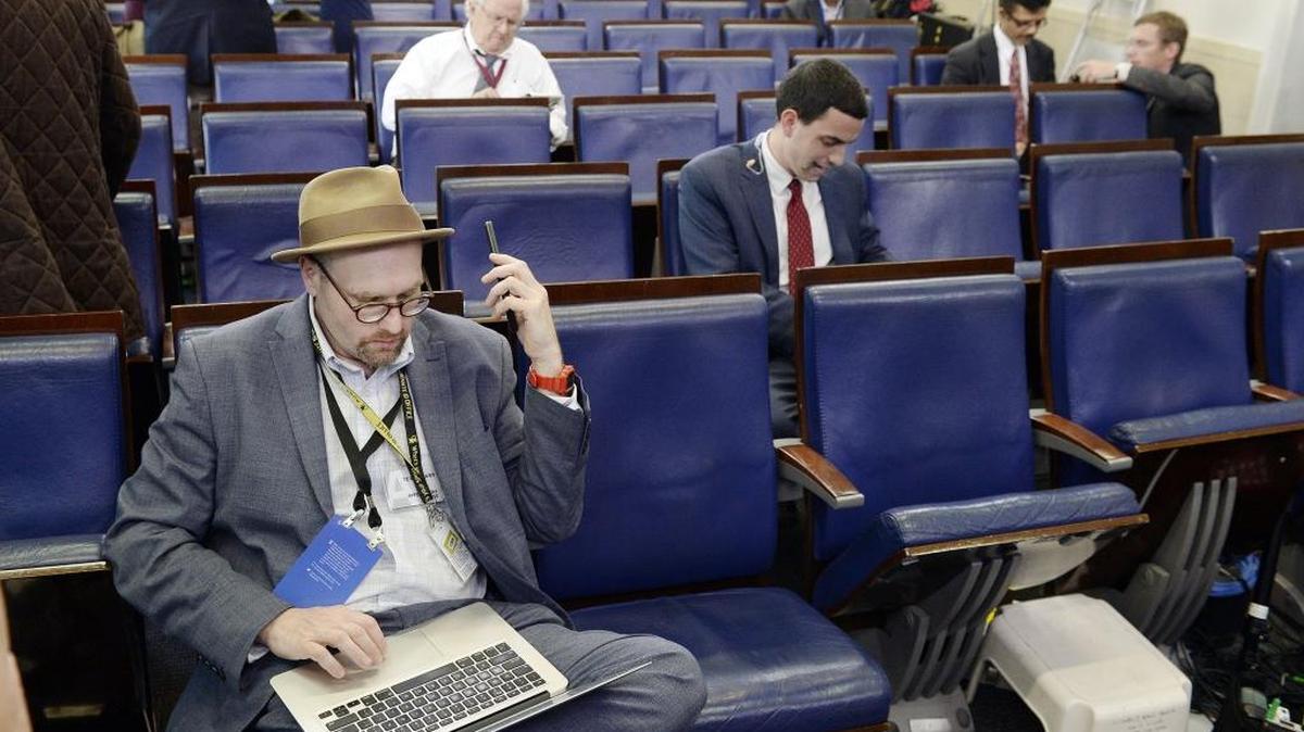 Reporters sit in the James S. Brady Press Briefing Room of the White House.