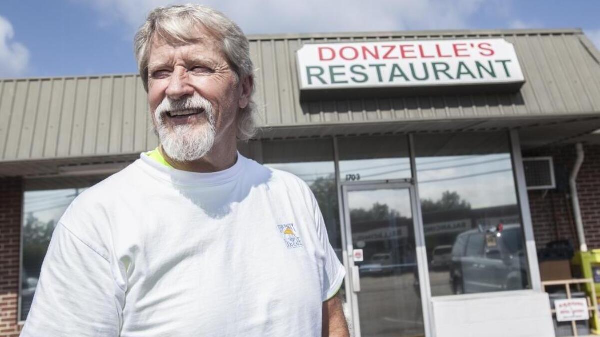 Russell Dickerson regularly greets customers at the door at Donzelle's Restaurant in Conway.