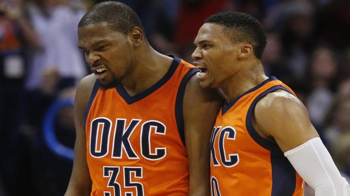 Kevin Durant (35) and Russell Westbrook (right) shout during a game in which the Oklahoma City Thunder were taking on the Utah Jazz last season.