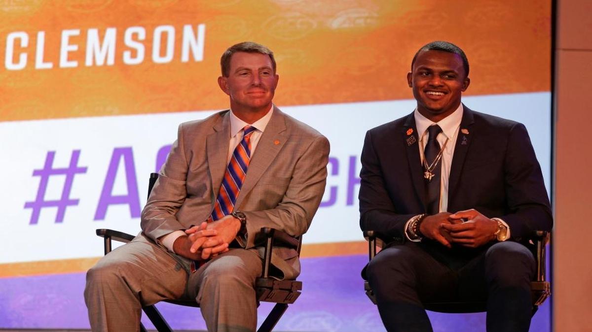 Clemson head coach Dabo Swinney (left) and Deshaun Watson smiles as they listen to a question during a news conference at the Atlantic Coast Conference Football Kickoff on Friday in Charlotte, N.C.