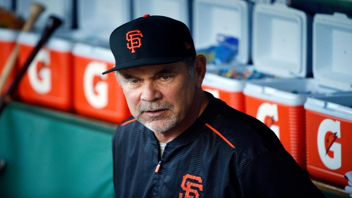 San Francisco Giants manager Bruce Bochy watches as players warm up before Game 2 of their National League Division Series game against the Chicago Cubs on Saturday.