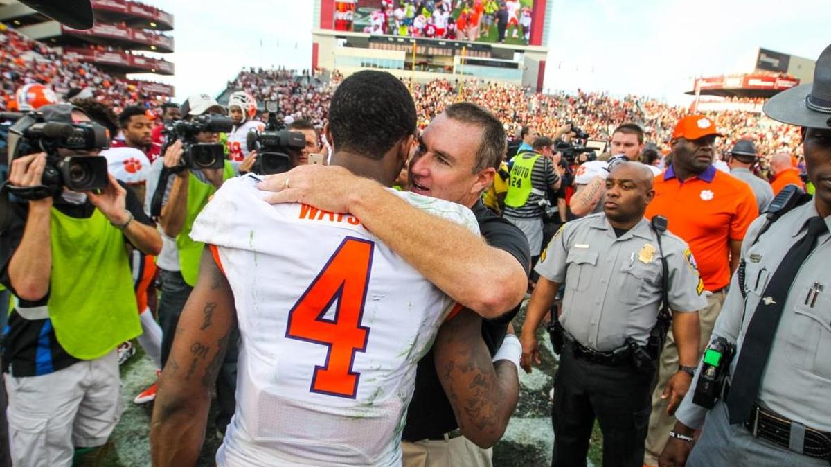South Carolina’s Shawn Elliott congratulates Clemson quarterback Deshaun Watson