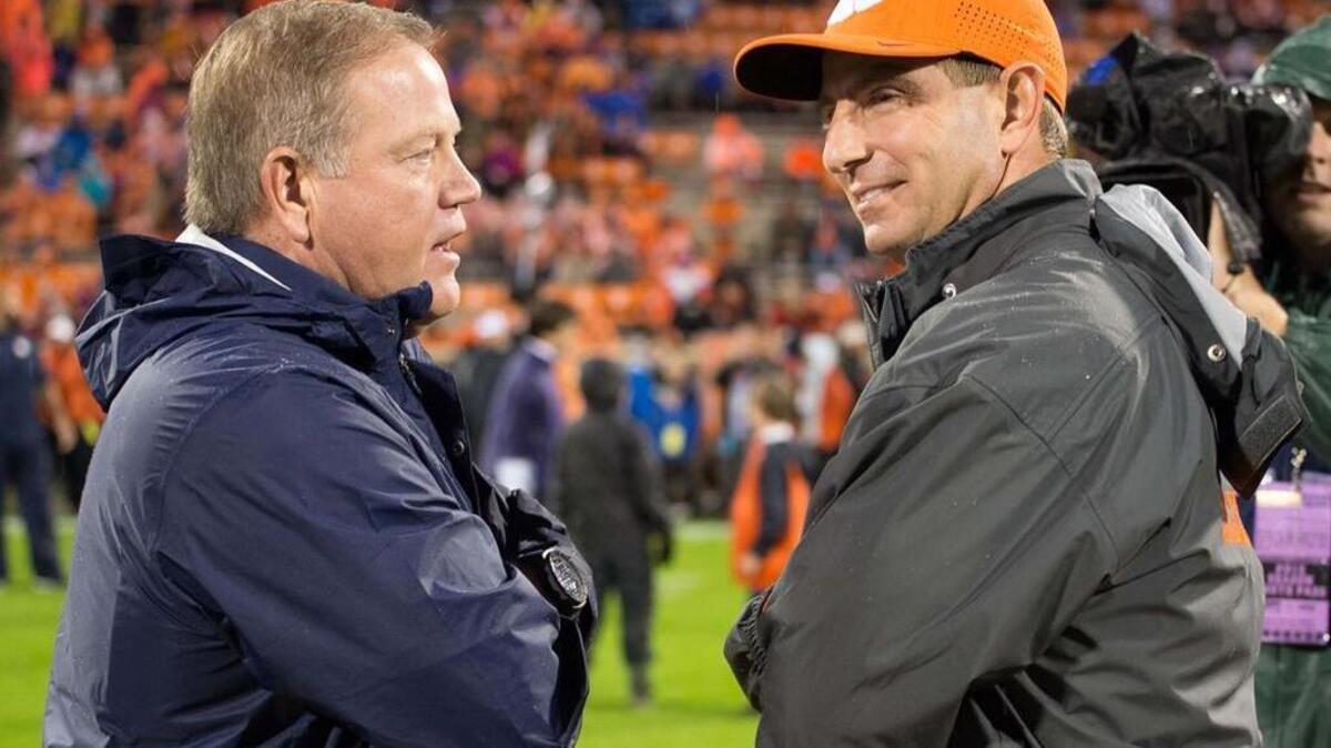 Oct 3, 2015; Clemson, SC, USA; Notre Dame Fighting Irish head coach Brian Kelly and Clemson Tigers head coach Dabo Swinney chat before the game at Clemson Memorial Stadium. Mandatory Credit: Matt Cashore-USA TODAY Sports