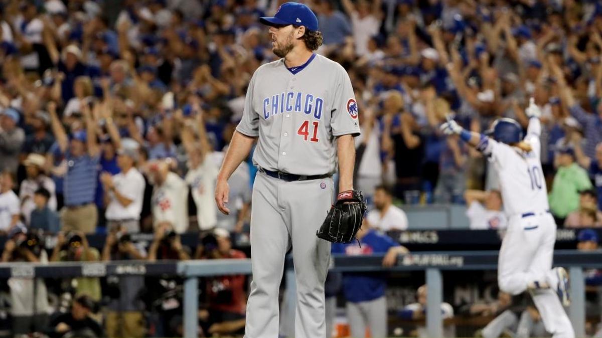 The Dodgers' Justin Turner (background) celebrates after a three-run walk-off home run off Cubs starting pitcher John Lackey during the ninth inning of Game 2 of the National League Championship Series on Sunday.