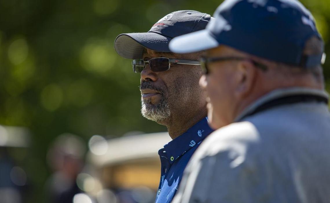 Hootie & the Blowfish lead singer Darius Rucker watches his partner Davis Love III tee off on the second hole at Barefoot Landing’s Dye Club Monday during the annual Hootie & the Blowfish Monday After the Masters tournament.