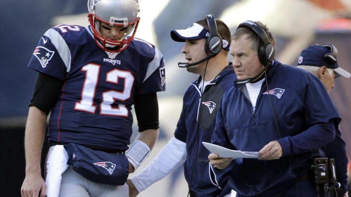 In this Sunday, Dec. 4, 2016, photo, New England Patriots quarterback Tom Brady (12) stands by head coach Bill Belichick during the first half of an NFL football game against the Los Angeles Rams in Foxborough, Mass. Offensive coordinator Josh McDaniels is also seen in the middle.