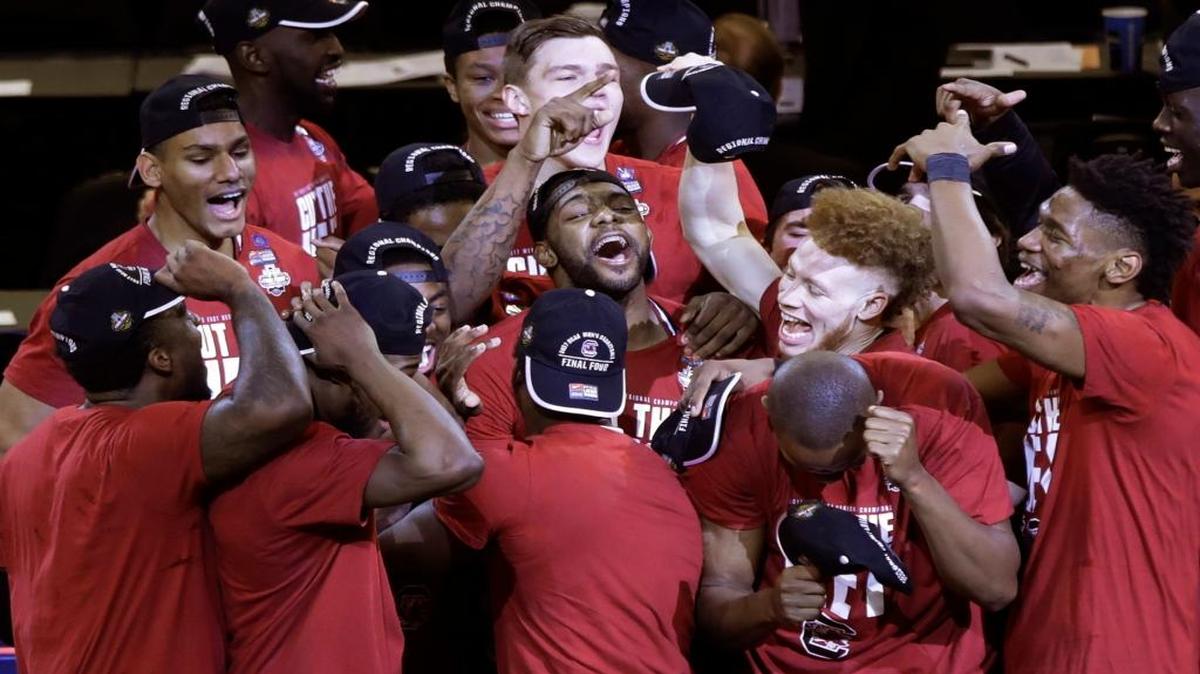South Carolina players celebrate after beating Florida 77-70 on Saturday to reach the Final Four of the NCAA Tournament.