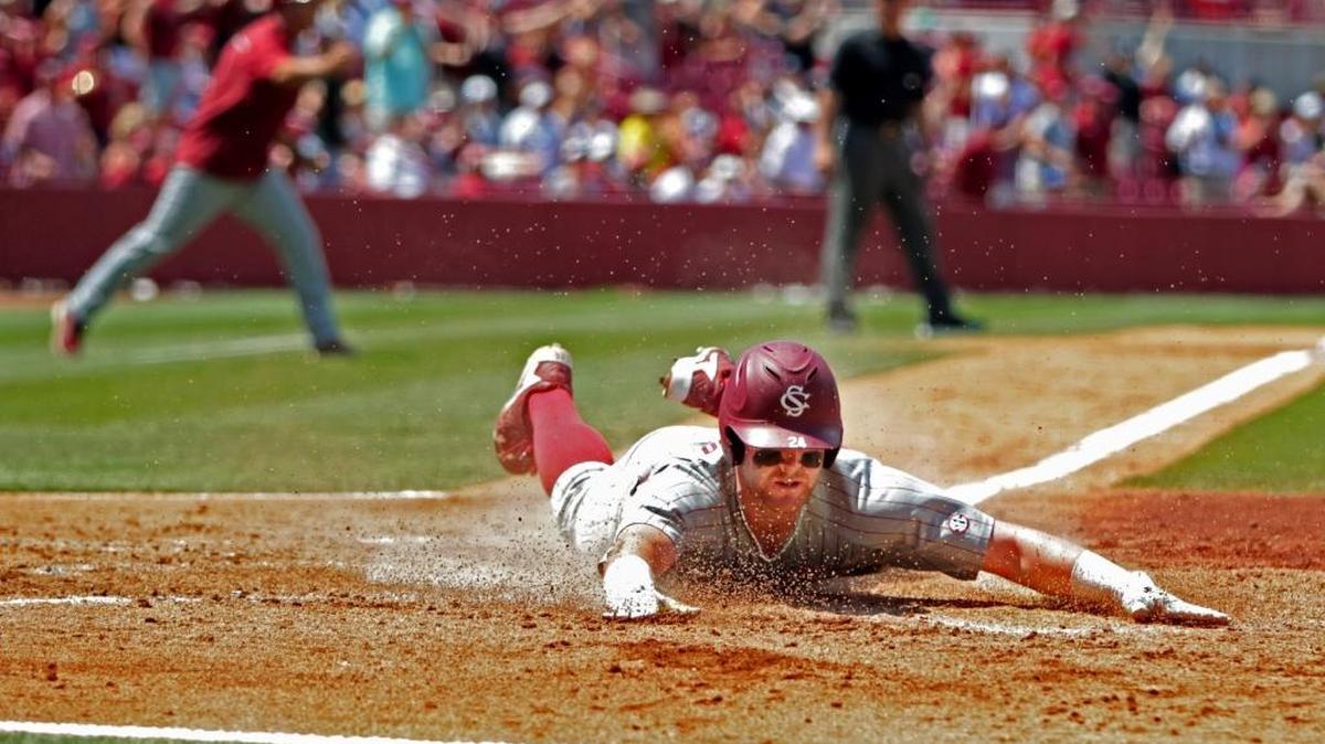 South Carolina's Alex Destino slides safely at home, scoring a run in the fourth inning against UNC Wilmington Tuesday at Founders Park during the NCAA Baseball Tournament's Columbia Regional.