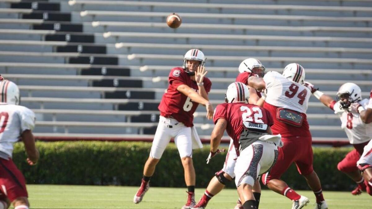 
South Carolina quarterback Connor Mitch completes a pass to Brandon Wilds during an Aug. 15 scrimmage.
