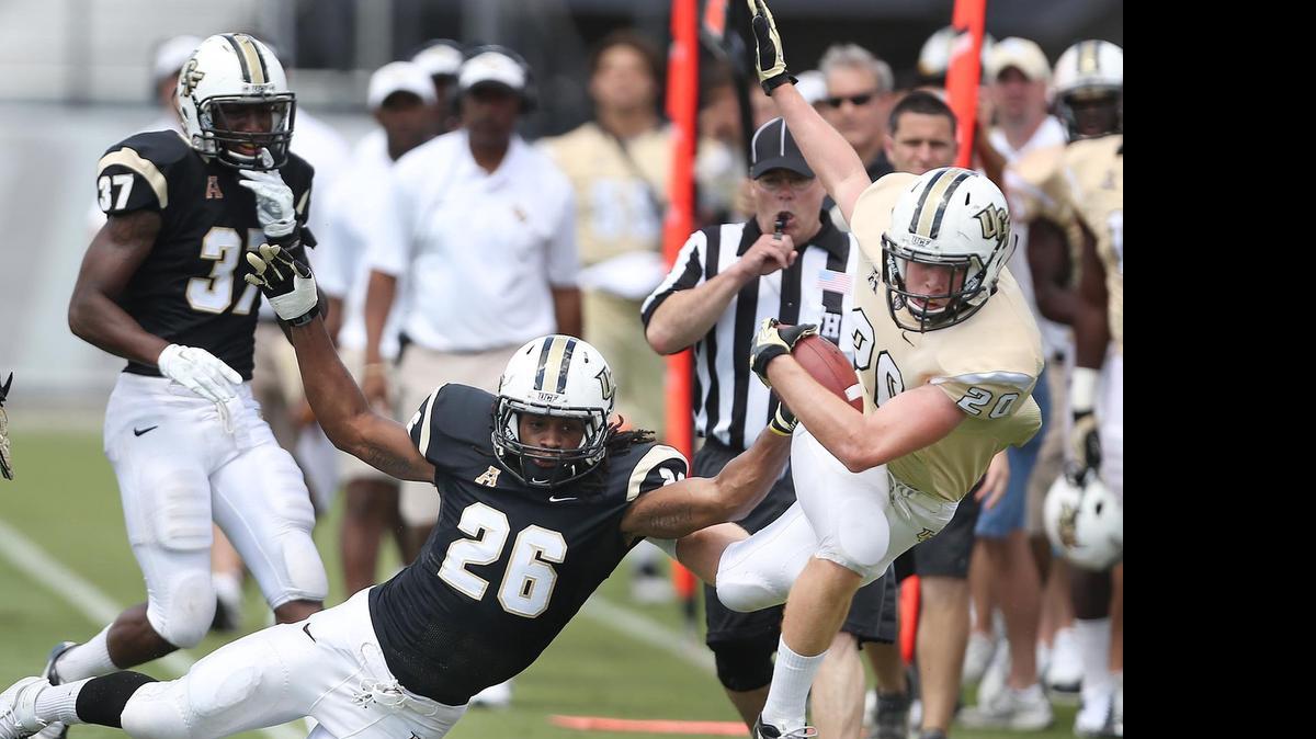 
Central Florida defensive back Clayton Geathers (26) knocks wide receiver Taylor Oldham (20) out of bounds during the UCF Football Spring Game at Bright House Networks Stadium in Orlando, Fla.
