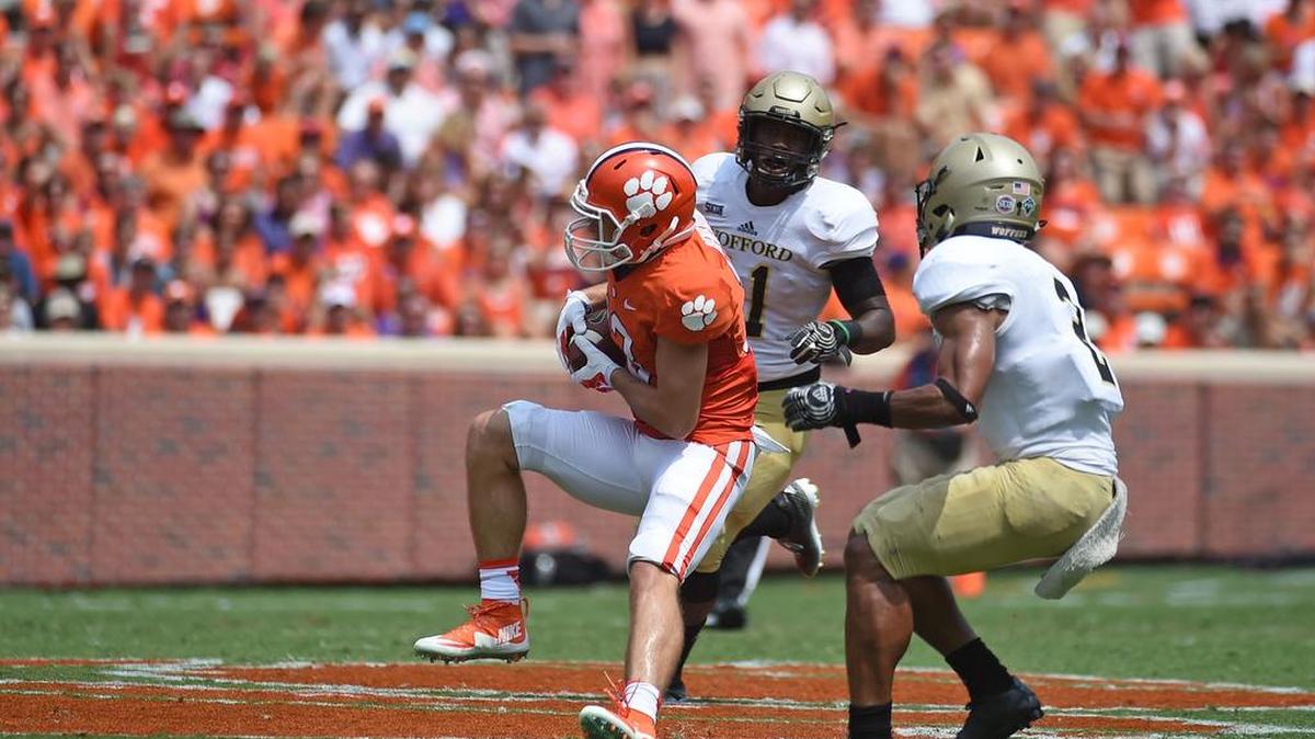 
Clemson wide receiver Hunter Renfrow (13) catches a pass as Wofford safety Jaleel Green (11) and Wofford cornerback Chris Armfield (2) defend.
