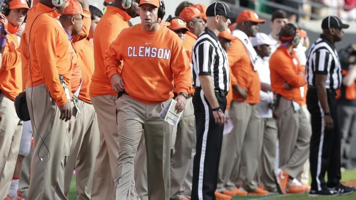 Clemson coach Dabo Swinney walks the sidelines during the Tigers’ win over North Carolina State.