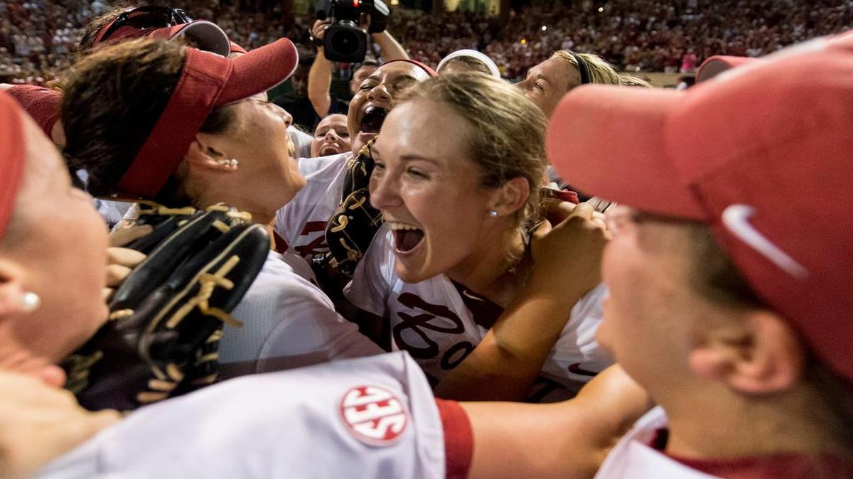 
Alabama’s Marisa Runyon (center) celebreates with teammates after hitting a game-winning grand slam against Oklahoma on Saturdya.
