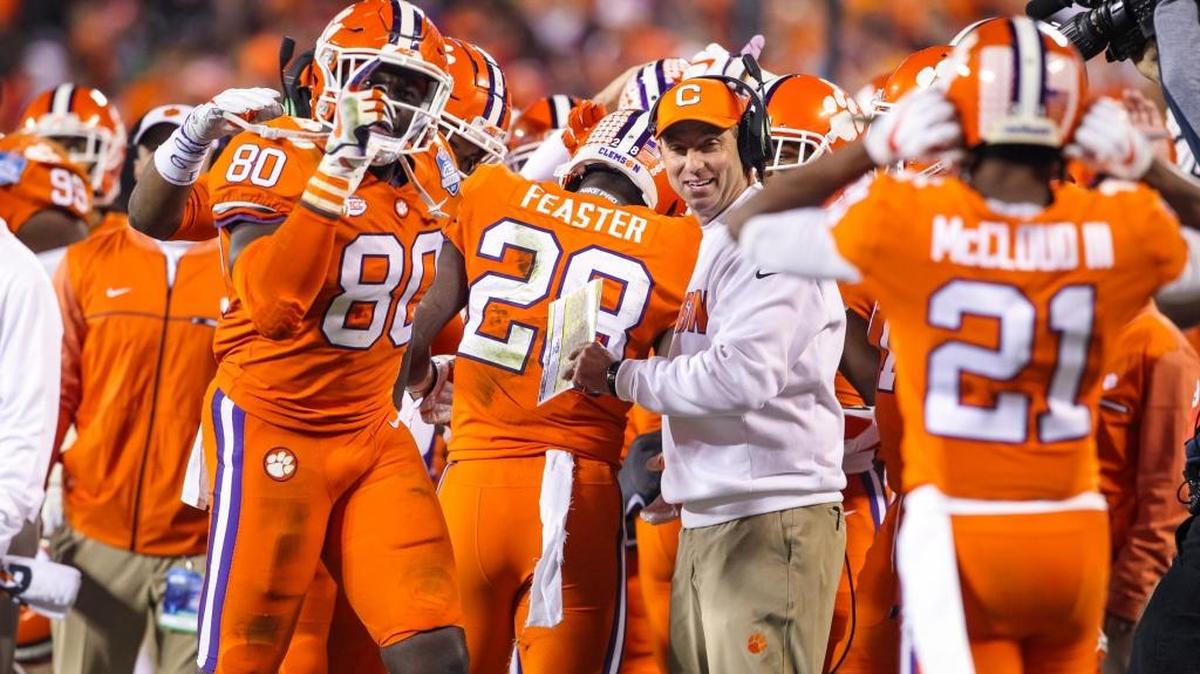 Clemson head coach Dabo Swinney celebrates with his players during the ACC championship game.