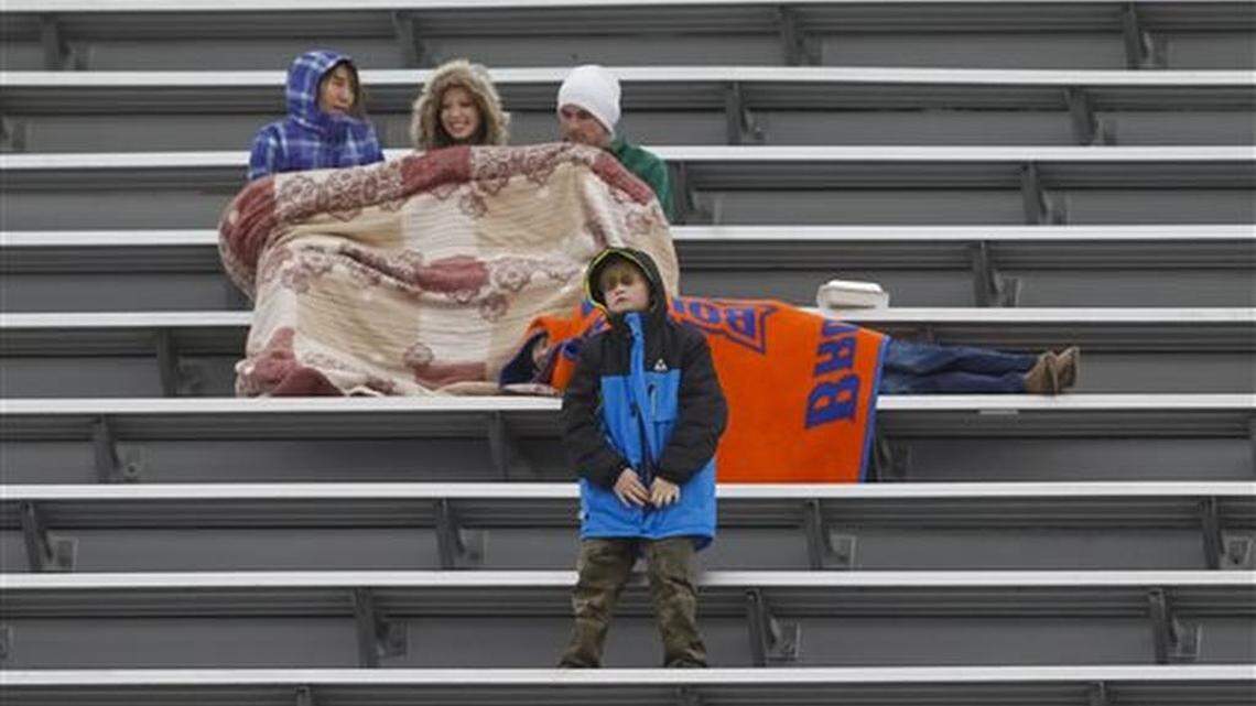 FILE - In this Dec. 22, 2015, file photo, fans in the upper deck watch the action during the second half of the Famous Idaho Potato Bowl NCAA college football game between Utah State and Akron in Boise, Idaho. Two people involved in the decision tell The Associated Press that the NCAA won't allow the creation of new bowl games for the next three years. The people spoke on condition of anonymity Monday, April 11, 2016, because the NCAA had not made a formal announcement.