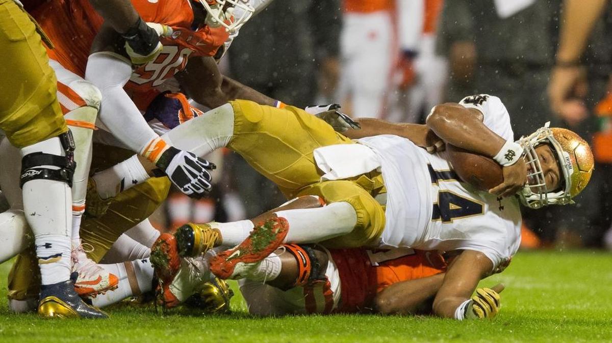 Oct 3, 2015; Clemson, SC, USA; Notre Dame Fighting Irish quarterback DeShone Kizer (14) is tackled by Clemson Tigers linebacker Travis Blanks (11) in the second quarter at Clemson Memorial Stadium. Mandatory Credit: Matt Cashore-USA TODAY Sports