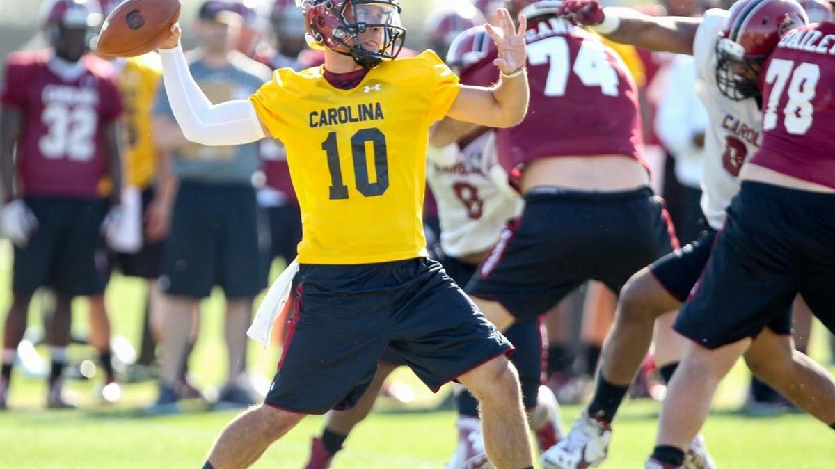 Quarterback Perry Orth sets up a pass during the first day of spring practice. 3/15/16
