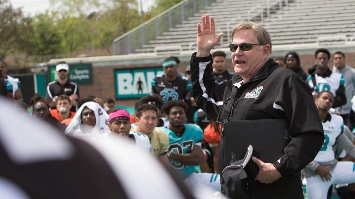 Coastal Carolina football coach Joe Moglia has signed Sean Fitzgerald, an offensive lineman who is transferring from the University of Michigan.