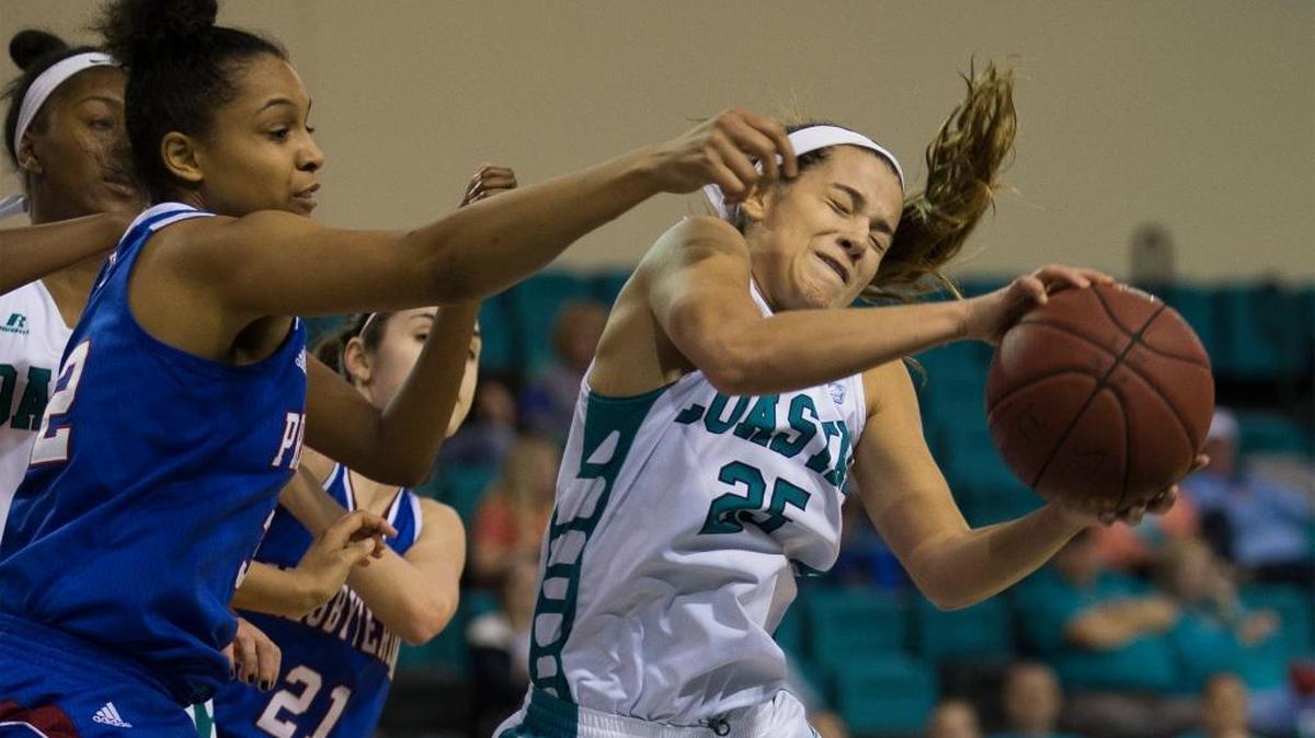Coastal Carolina guard Josie Utley (25) pulls down a rebound against Presbyterian on Tuesday.