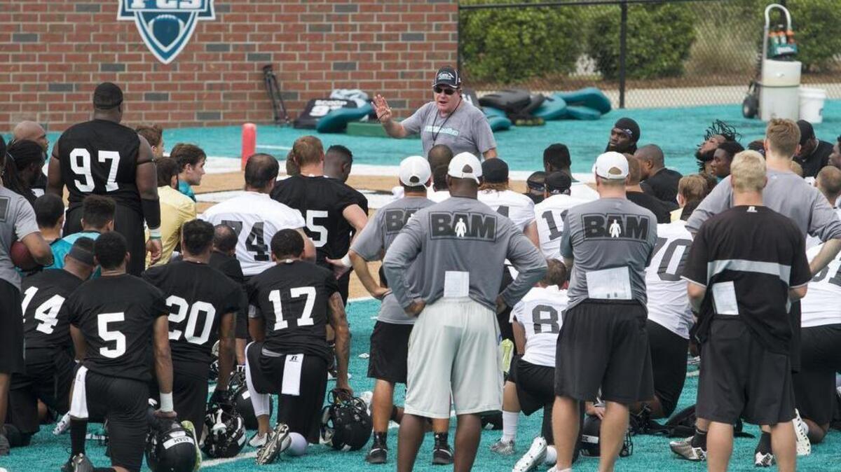 
Coastal Carolina coach Joe Moglia speaks to his players following the first fall practice earlier this week at Brooks Stadium.

