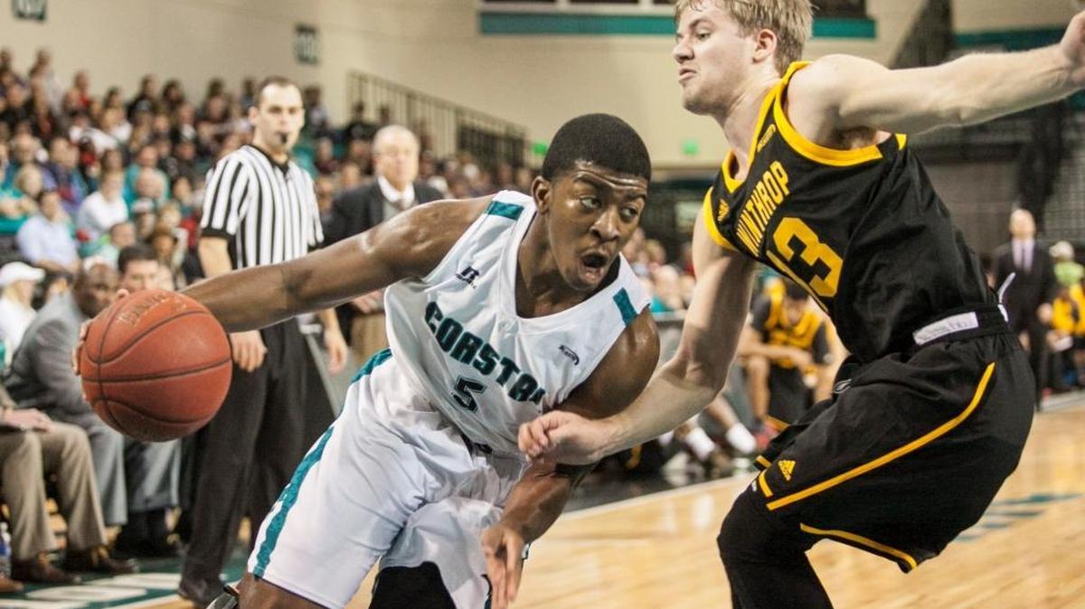 Coastal Carolina’s Jaylen Shaw drives past Winthrop’s Bjorn Broman during the teams’ matchup earlier this season.