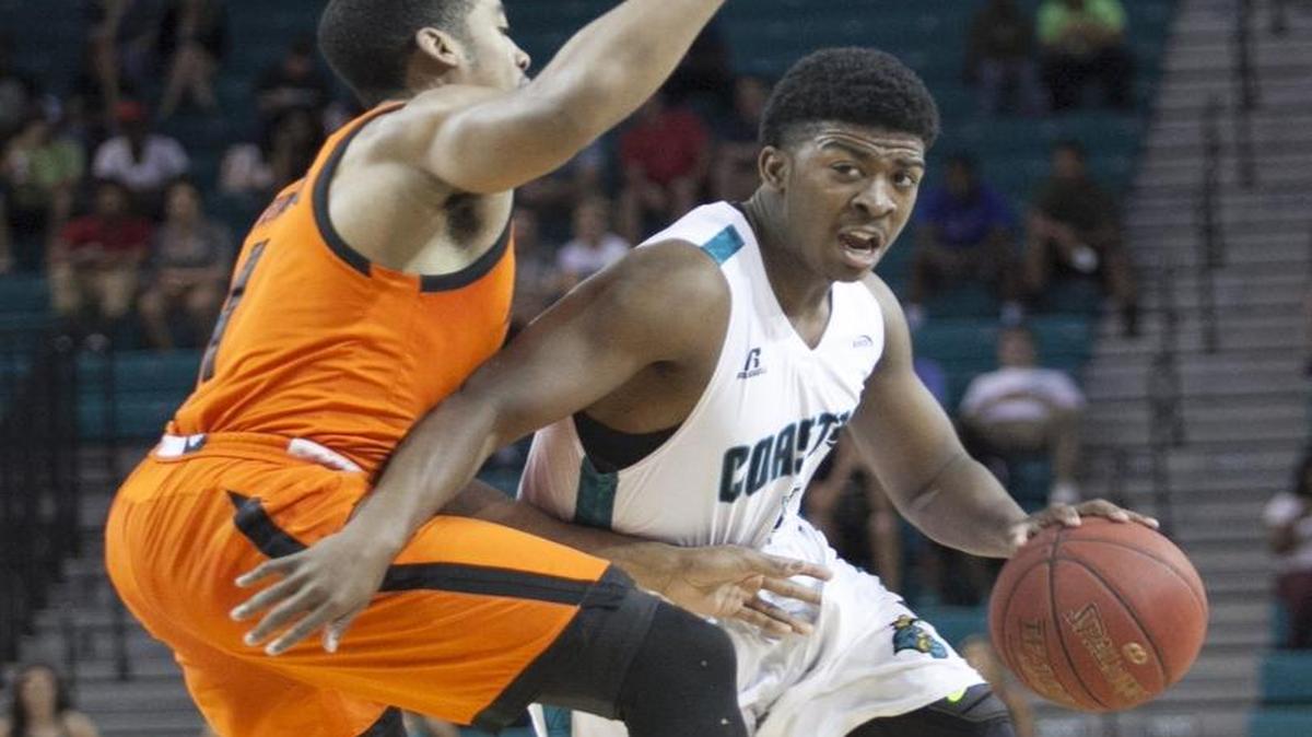Coastal Carolina’s Jaylen Shaw drives past Mercer defenders during the Chanticleers’ opening round game of the CollegeInsider.com Tournament (CIT).
