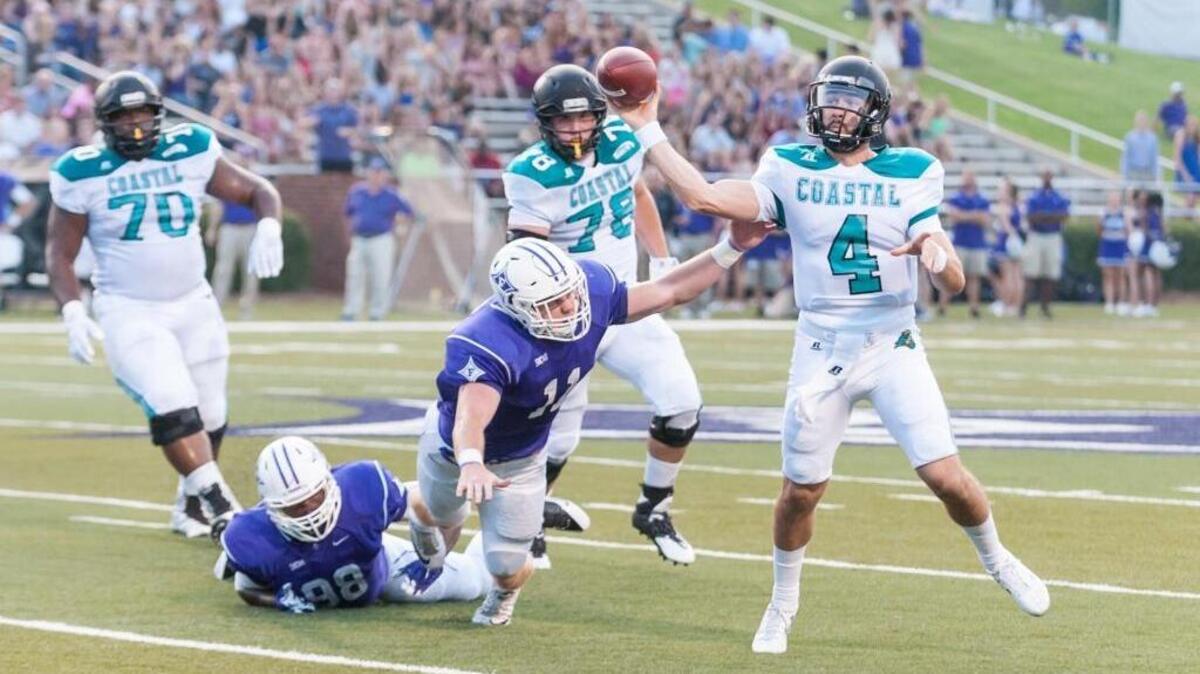 
Coastal Carolina’s Alex Ross makes a throw during Saturday’s game against Furman.
