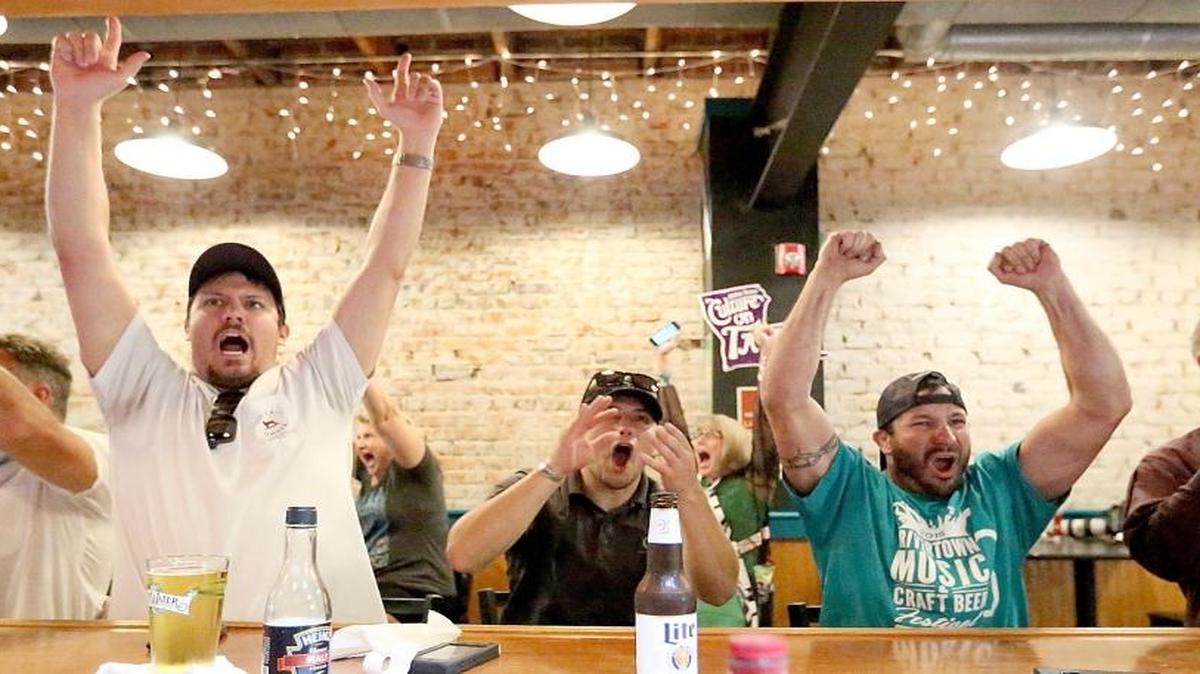 Coastal Carolina wins the College World Series and fans at Crafty Rooster in Conway celebrate on Thursday, June 30, 2016. The three men cheering in the middle are, from left, Jordan James, Kurt Richardson and Matt Savage.