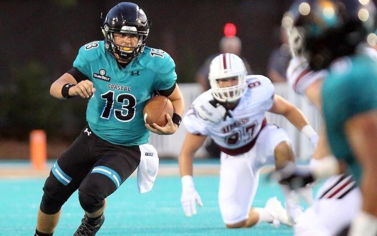 Coastal Carolina quarterback Tyler Keane, pictured running in the season opener against Massachusetts at Brooks Stadium on Sept. 2, is 7-2 as a starter.
