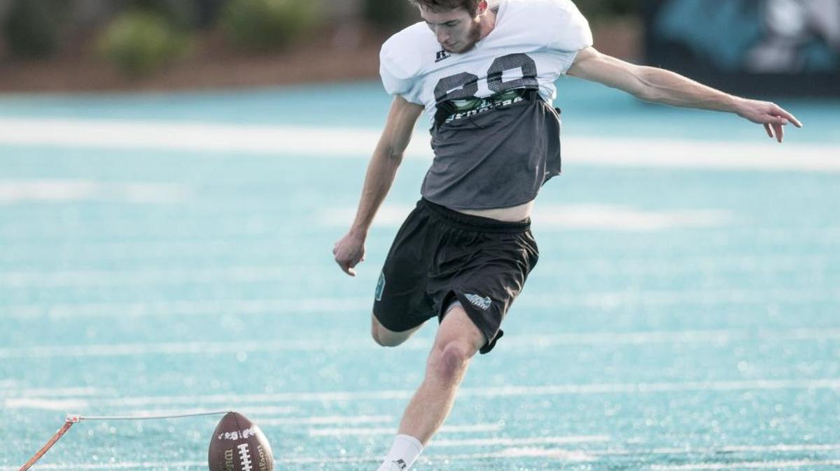 Coastal Carolina kicker Ryan Granger takes aim at the goal posts during a recent practice.