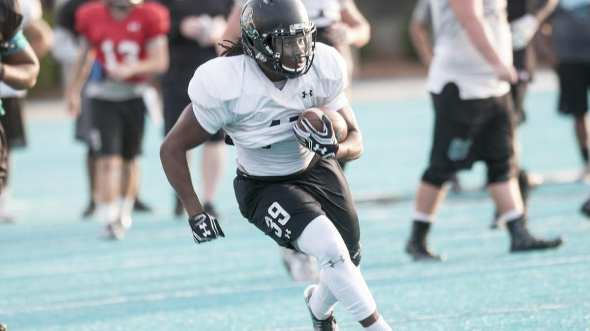 Jah-Maine Martin runs the ball during Coastal Carolina football practice Wednesday.